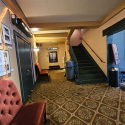 The Grandin Theatre - The inner lobby of the theatre with the elegant stairs going to the second floor where they have an art gallery in the lobby there.
