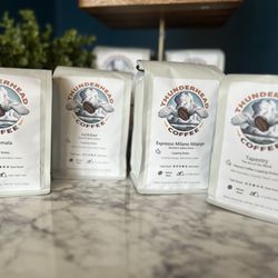 Dog Ear Books & Wild Fox Coffee - We have bags of our fantastic whole bean Thunderhead coffee and espresso and will be happy to grind it for you!