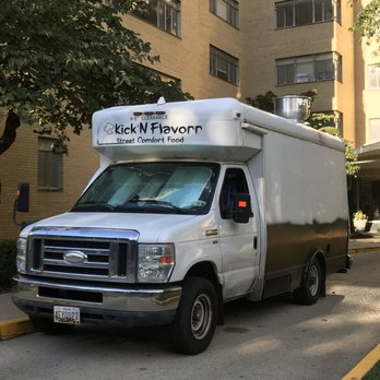 Kick'n Flavorr - a delivery truck parked in front of a building - Comfort Food Near Me Kick'n Flavorr - a delivery truck parked in front of a building - Comfort Food Near Me