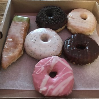 Dottie's Donuts - Left then clockwise: Greased pole, chocolate oreo, vanilla glazed, chocolate glazed, raspberry vanilla, lemon poppy - Cafes Near Me - Philadelphia, Pennsylvania