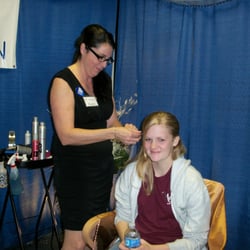 Viva Grand Salon - Stylist Christy Bradford Doing Feather Extensions.