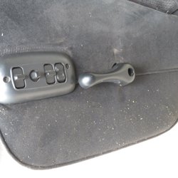 Magic's Auto Upholstery - Foam crumbs, fabric not placed properly around seat controls.