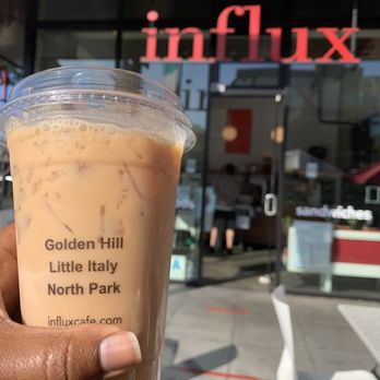 Influx - a hand holding a cup of iced coffee - Coffee & Tea Near Me - San Diego, California Influx - a hand holding a cup of iced coffee - Coffee & Tea Near Me - San Diego, California