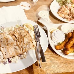 Garlic ahi on a bed of coleslaw with side partner calamari fries