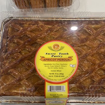 Sweet Tooth Pastry - a close up of a tray of pastries - Bakeries Near Me - Los Angeles, California