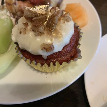 Libra - Red velvet cupcake with glitter like literally glitter and gold flecks and nuts for the topping! - Breakfast & Brunch Near Me - Orlando, Florida Libra - Red velvet cupcake with glitter like literally glitter and gold flecks and nuts for the topping! - Breakfast & Brunch Near Me - Orlando, Florida
