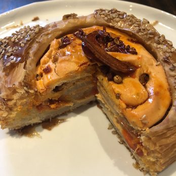 S.K.Y. - gochujang danish with piece cut out of it. Look at those layers! - New American Near Me - Chicago, Illinois S.K.Y. - gochujang danish with piece cut out of it. Look at those layers! - New American Near Me - Chicago, Illinois