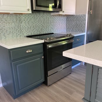 Bauer Flooring & Tile LLC - Kitchen flooring with new quartz countertops and repainted base cabinets and hardware. - Flooring Near Me - Waipahu, Hawaii Bauer Flooring & Tile LLC - Kitchen flooring with new quartz countertops and repainted base cabinets and hardware. - Flooring Near Me - Waipahu, Hawaii