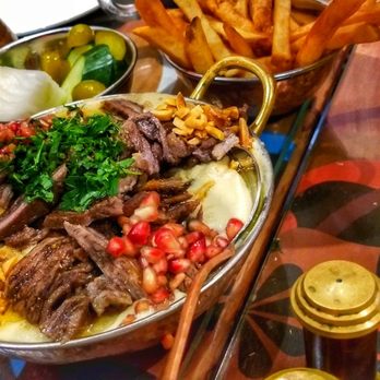 Roman Zaman - Looked good but overpowering with hummus like thing at the bottom.  Beef fatoush - Middle Eastern Near Me - Mississauga, Ontario