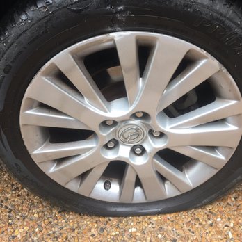 Apple Towing Co - the flat tire before the tow driver arrived. It's the top bolt that was stuck. - Towing Near Me - Houston, Texas Apple Towing Co - the flat tire before the tow driver arrived. It's the top bolt that was stuck. - Towing Near Me - Houston, Texas