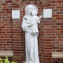 Our Lady of the Rosary Catholic Church - Beautiful statue of Madonna and child in the back parking lot!