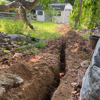 Recinos General Contracting - New 18" trench from house to new shed to run electrical. - General Contractors Near Me Recinos General Contracting - New 18" trench from house to new shed to run electrical. - General Contractors Near Me