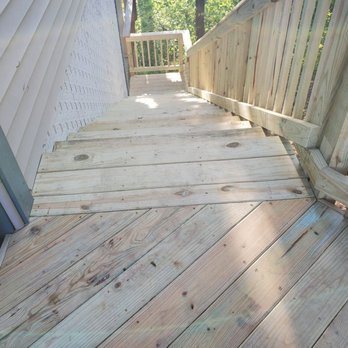 Karma Construction - a close up of a wooden deck - General Contractors Near Me Karma Construction - a close up of a wooden deck - General Contractors Near Me