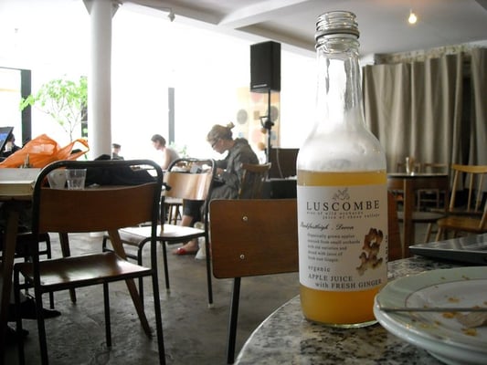 Photo of Café Oto - London, XGL, GB. tasty juice and lots of tables and sunlight