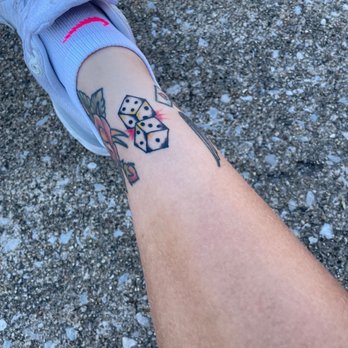 Self Inflicted Studios - View of dice sandwiches in between da two tattoos by Phil - Tattoo Near Me - St. Louis, Missouri