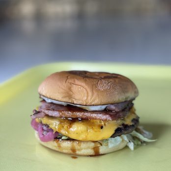 Accomplice - a hamburger on a yellow plate - Sandwiches Near Me - Bellingham, Washington Accomplice - a hamburger on a yellow plate - Sandwiches Near Me - Bellingham, Washington