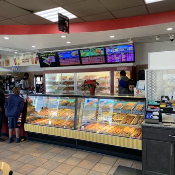 Tony's Donuts - Hazelwood - Donut case and menu board. Bagels and MORE donuts are good n more cases behind the counter. There's another case with desserts! - Donuts Near Me - Hazelwood, Missouri Tony's Donuts - Hazelwood - Donut case and menu board. Bagels and MORE donuts are good n more cases behind the counter. There's another case with desserts! - Donuts Near Me - Hazelwood, Missouri