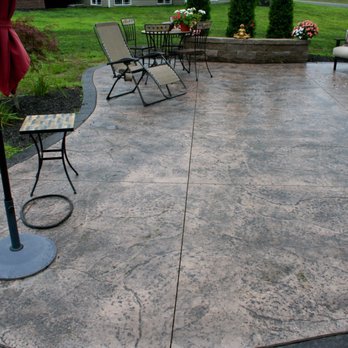 Homeview Builders - Custom stamped concrete patio with mocha accent - Windows Installation Near Me Homeview Builders - Custom stamped concrete patio with mocha accent - Windows Installation Near Me