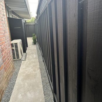 Green Sierra Landscaping - Side yard #2 with new concrete, boxwoods and custom narrow shed with sliding door - Tree Services Near Me - San Jose, California