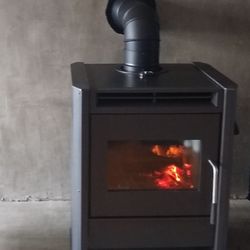 Dugan's Heating Solutions - Installation of Blaze King Chinook 20 wood stove on concrete hearth.