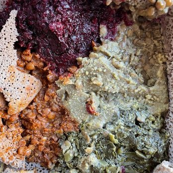 Aberus Ethiopian Restaurant - Veggie combo #2 (vegan) -  inside: beets, red misir wot, yellow misir wot, gomen, - Ethiopian Near Me - Portland, Oregon
