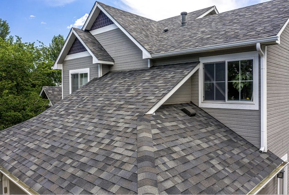 Slide of Her Construction Roofing Specialists 