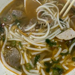 Half eaten spicy beef noodle soup. Half eaten spicy beef noodle soup.