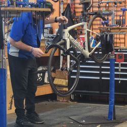 The Bike Zone - Tech working on Specialized bike