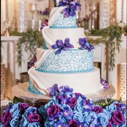 Our wedding cake. A white almond flavor with white icing. Gum paste orchids! Our wedding cake. A white almond flavor with white icing. Gum paste orchids!