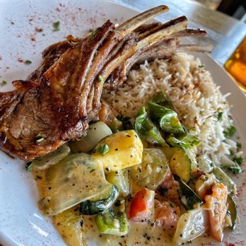 Arabesque - New Zealand lamb chops with creamy garlic butter vegetables. - Mediterranean Near Me - Columbia, South Carolina Arabesque - New Zealand lamb chops with creamy garlic butter vegetables. - Mediterranean Near Me - Columbia, South Carolina