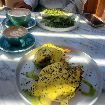 Mood - Avo toast on far side and eggs Benedict with Bacon near side. The coffee was delicious also. - Breakfast & Brunch Near Me - Los Angeles, California