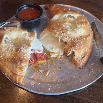 Mineo's Pizza & Wings - Meaty Calzone opened up....the melt and pull is real! - Pizza Near Me - Franklin, Tennessee Mineo's Pizza & Wings - Meaty Calzone opened up....the melt and pull is real! - Pizza Near Me - Franklin, Tennessee