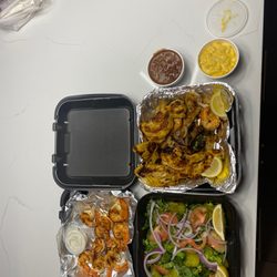 Sam's Southern Eatery - Grilled shrimp salad and grill fish shrimp and chicken combo with red beans and rice and mac and cheese