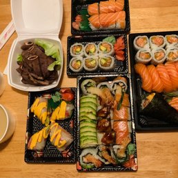 Premium salmon lover, dragon lover combo, red California roll, spicy salmon & avocado maki, beef short ribs (appetizer), rice paper roll Premium salmon lover, dragon lover combo, red California roll, spicy salmon & avocado maki, beef short ribs (appetizer), rice paper roll