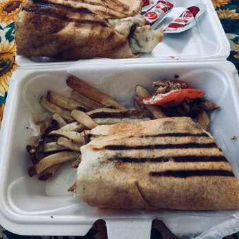 Jerusalem Food Imports - a sandwich and fries in a styrofoam container - Halal Near Me - Youngstown, Ohio