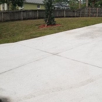 Whites LawnCare - a concrete driveway and fence - Lawn Services Near Me - Palm bay, Florida Whites LawnCare - a concrete driveway and fence - Lawn Services Near Me - Palm bay, Florida