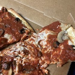 Little Caesars Pizza - Here's the undercooked pizza with half of the toppings slogged off