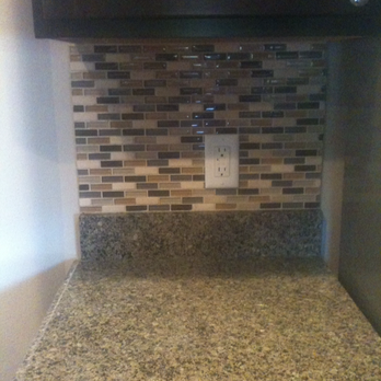 Woodchuck Construction - a kitchen counter with a light switch - General Contractors Near Me