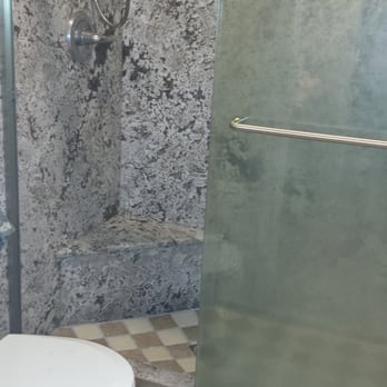 M & G Construction - a bathroom with a glass shower door - General Contractors Near Me - Modesto, California M & G Construction - a bathroom with a glass shower door - General Contractors Near Me - Modesto, California
