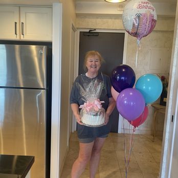 Demming's Delivery - This is the way the cake was wrapped when it arrived along with the festive balloons. - Food Delivery Services Near Me - Lahaina, Hawaii