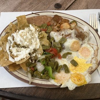 Restaurante El Nido - Breakfast Chilaquiles. With cactus, sunnyside up quail eggs, beans, and potatoes. - Mexican Near Me - Rosarito, BCN Restaurante El Nido - Breakfast Chilaquiles. With cactus, sunnyside up quail eggs, beans, and potatoes. - Mexican Near Me - Rosarito, BCN