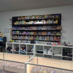 The Gamer's Nest - Selection of MTG packs, Pokemon packs, and Dragonshield matte/double matte sleeves
