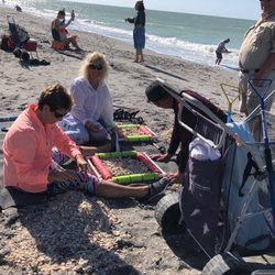 Key Culinary Tours - Using the blanket to sift through shells and sand to find shark's teeth