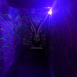 Black light art at the bottom of the stairs next to the entrance to the basement. Black light art at the bottom of the stairs next to the entrance to the basement.