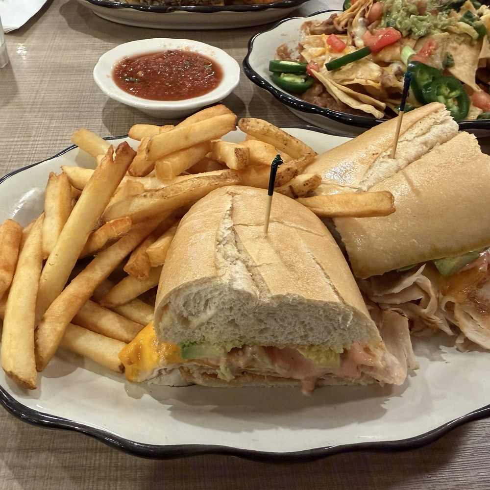 Turkey club sandwich with fries Turkey club sandwich with fries
