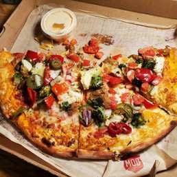 a whole pizza in a box