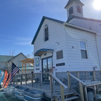 Kraemer & Kin - a white church with a steeple - Breweries Near Me - North Hero, Vermont
