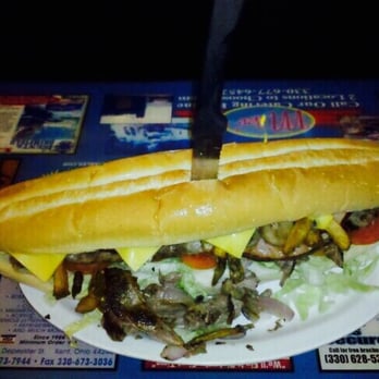 Mike's Place - The Dirk Diggler!!! 12 solid inches of grilled ham, roast beef, American, lettuce, tomato, grilled onions& mushrooms, fries&BBQ - American Near Me - Kent, Ohio