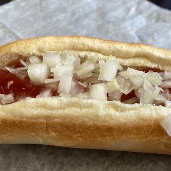 Brian's Grill - a hot dog with onions and ketchup - Burgers Near Me - China Grove, North Carolina