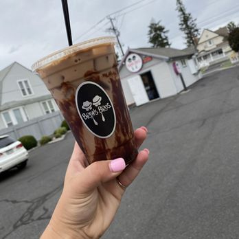 Brews Bros Espresso - a hand holding a cup of coffee - Desserts Near Me - Spokane, Washington Brews Bros Espresso - a hand holding a cup of coffee - Desserts Near Me - Spokane, Washington